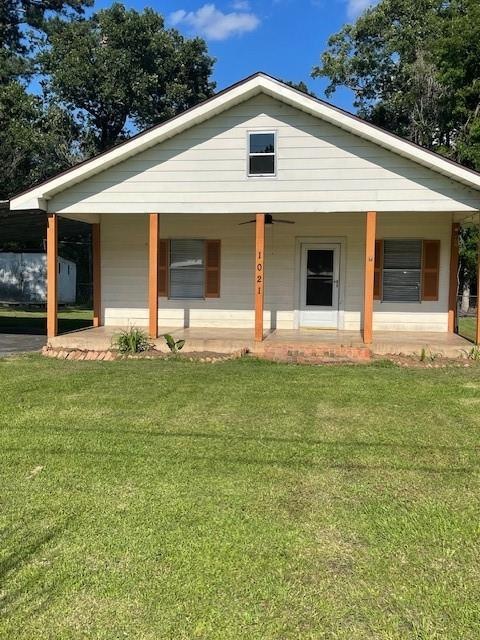 View of front of property with covered porch and a