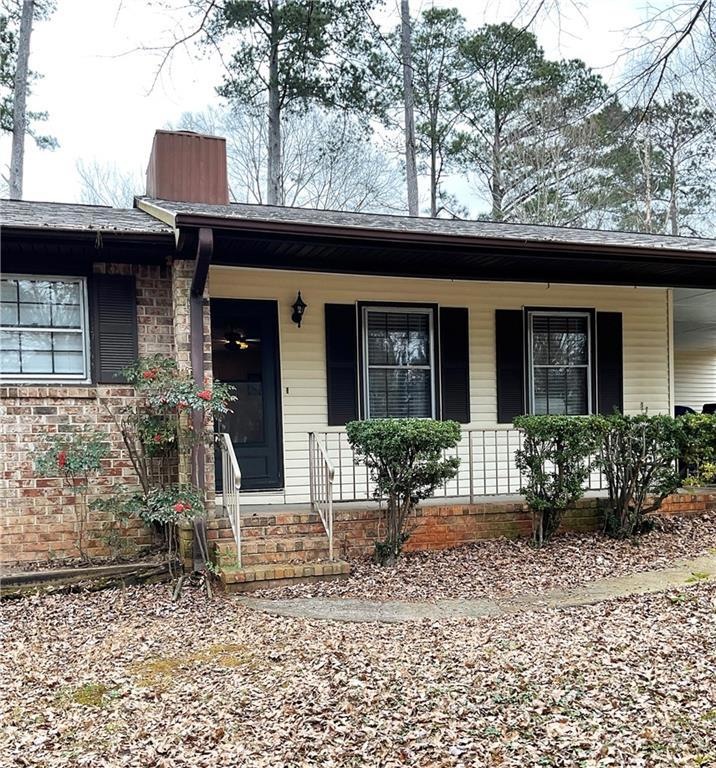 Ranch-style home featuring covered porch