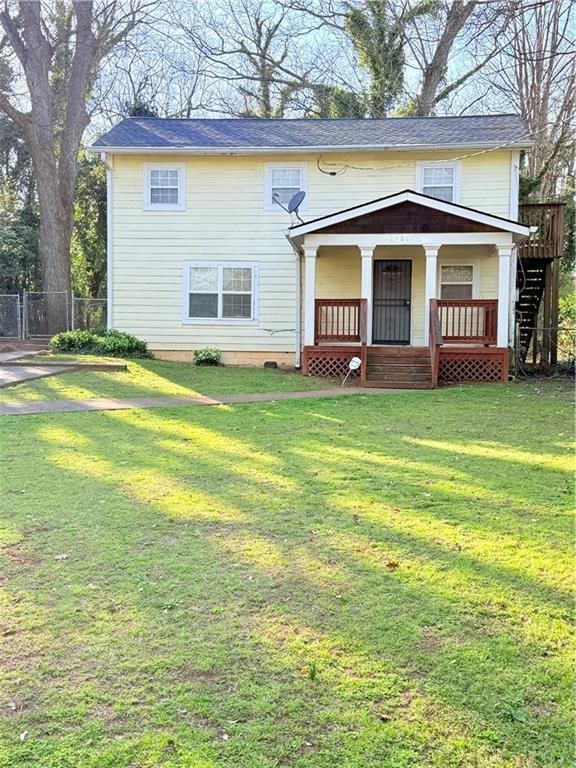 View of front of home featuring a porch, a front l