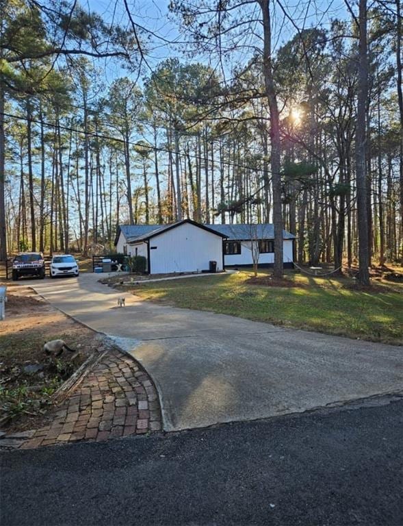 View of front of home featuring a front lawn