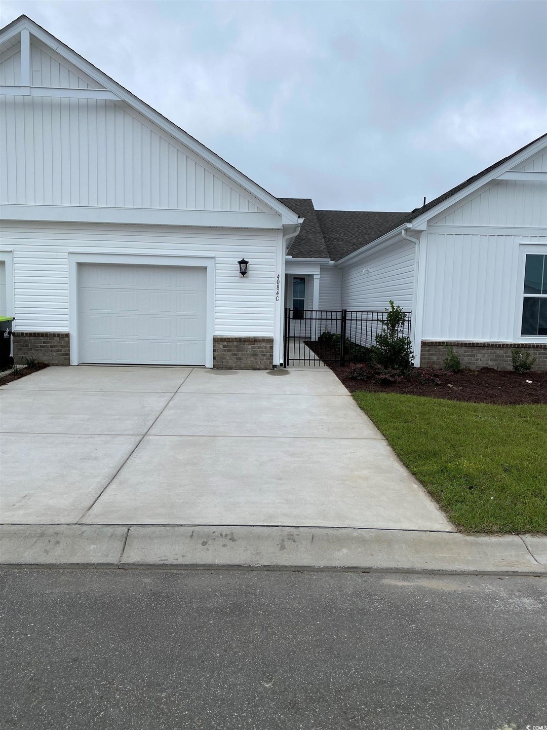 View of front facade featuring a garage