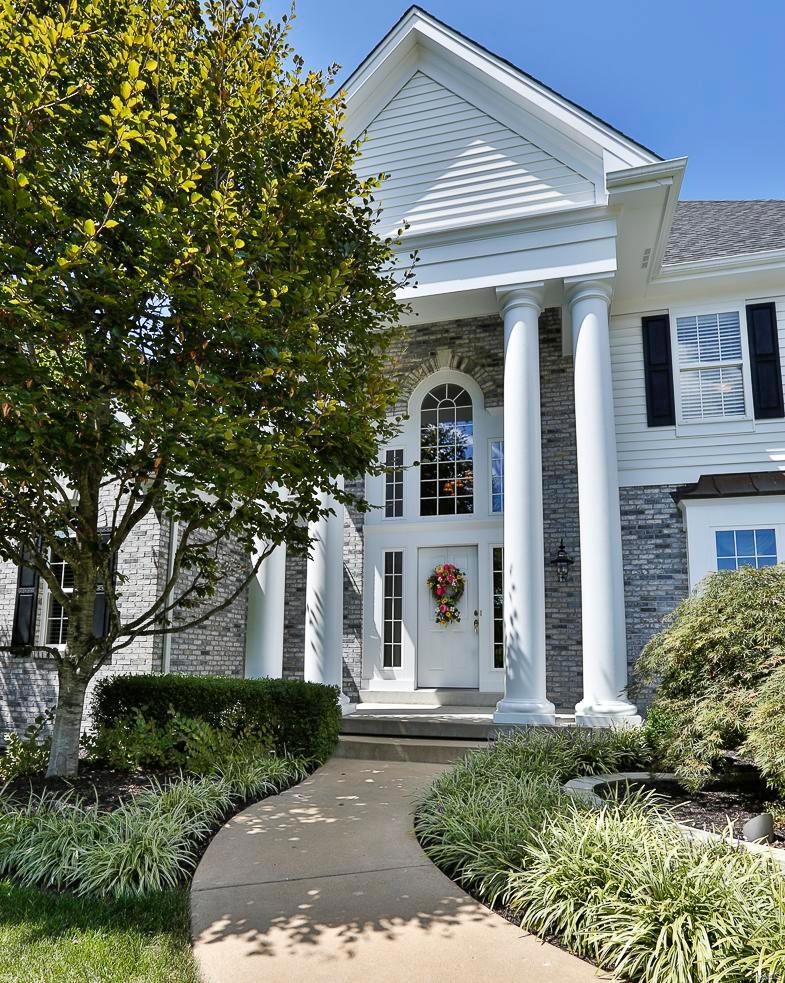 Alluring 2 Story front covered porch with stately 