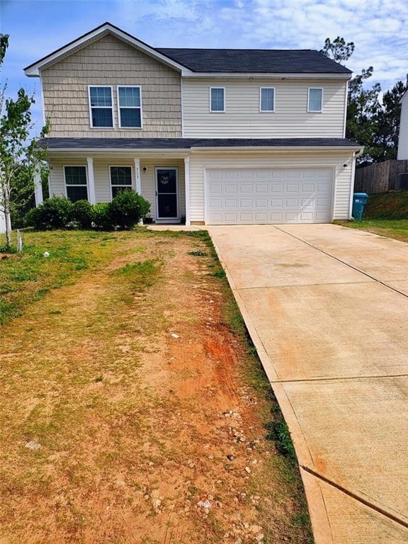 Traditional home with an attached garage, a front 