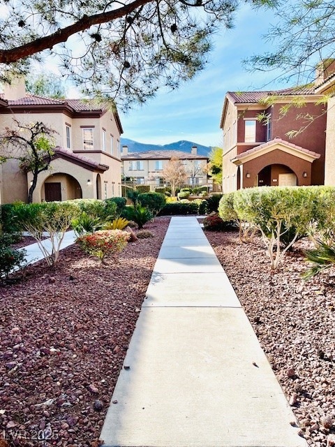 Walkway to entry with community & mountain views