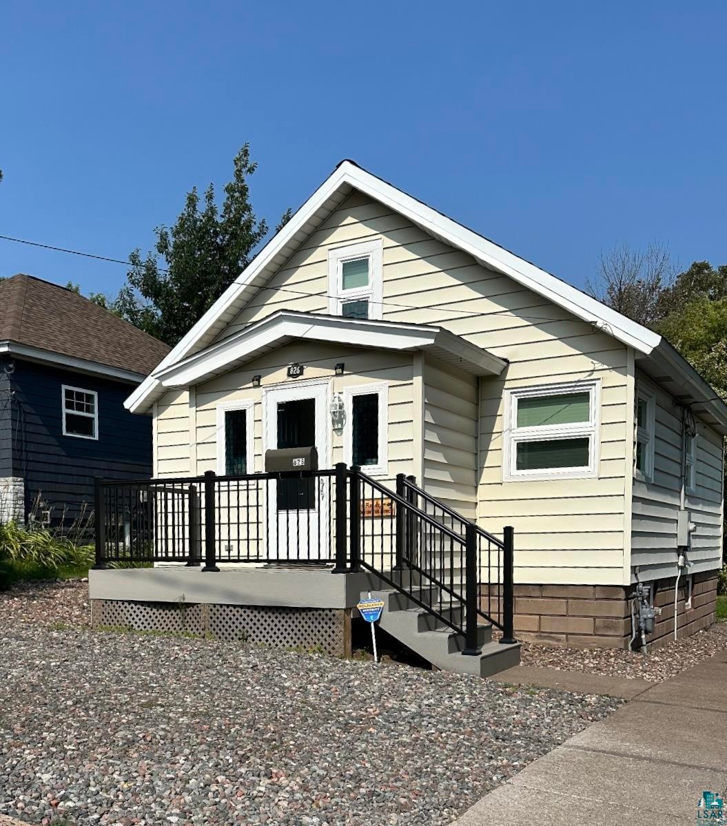Bungalow-style house with a deck