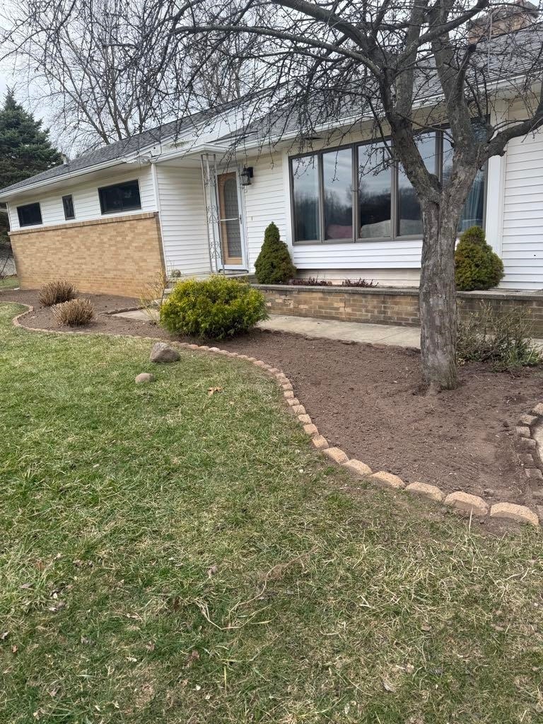Lovely 3 bedroom 1 1/2 bath room with a 2 car attached garage. Large living room with large windows to let the natural lighting in. Eat in kitchen. Nice family room with slider to go outside. Large fenced in yard. Full basement. New septic field.