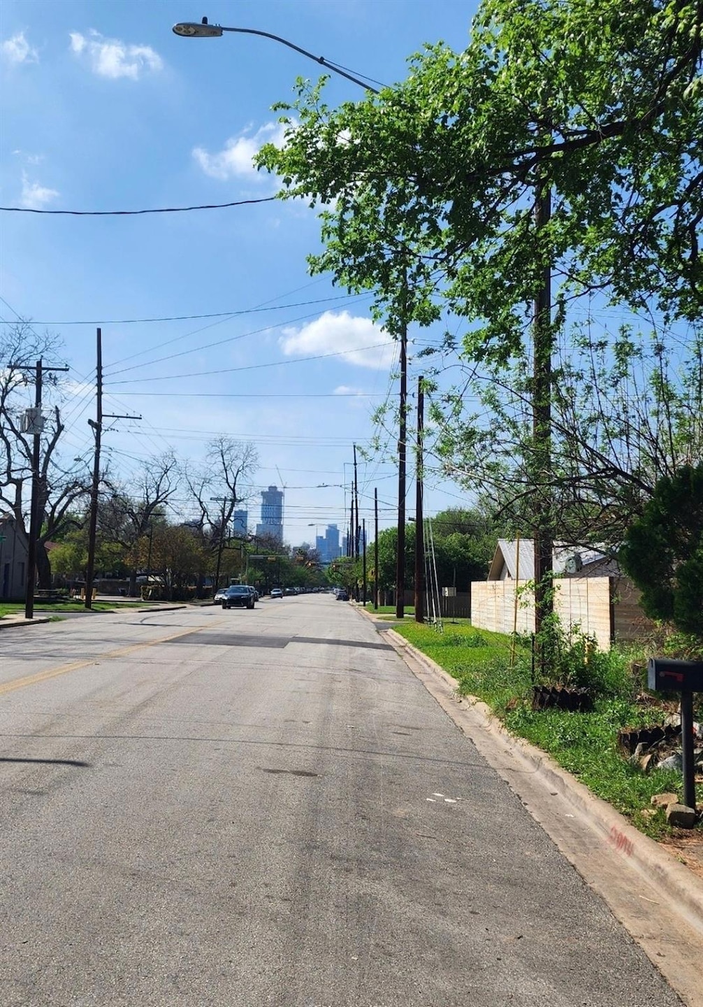 View of street with street lights and curbs