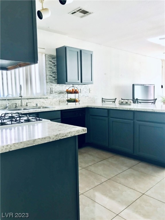 Backsplash in this kitchen coordinates all the col
