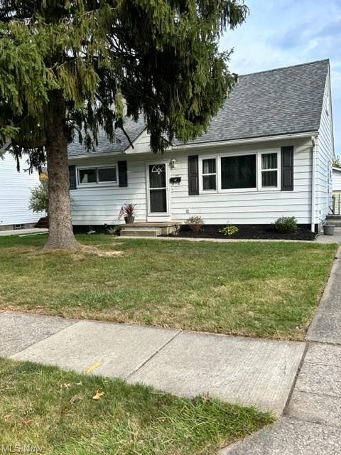 View of front of property with a front yard