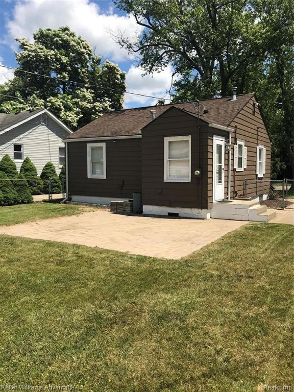 Back of house and huge paver patio.