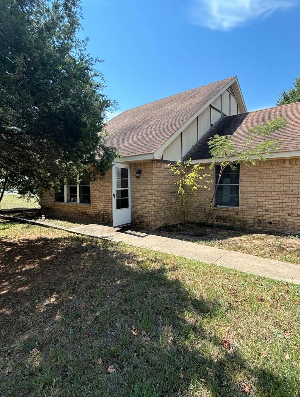 View of home's exterior featuring a lawn
