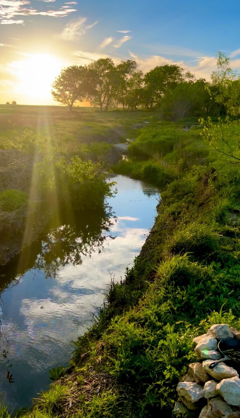 Water view with rural landscape