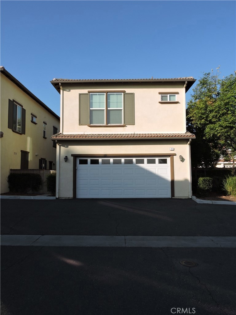Detached unit with 2 car garage.