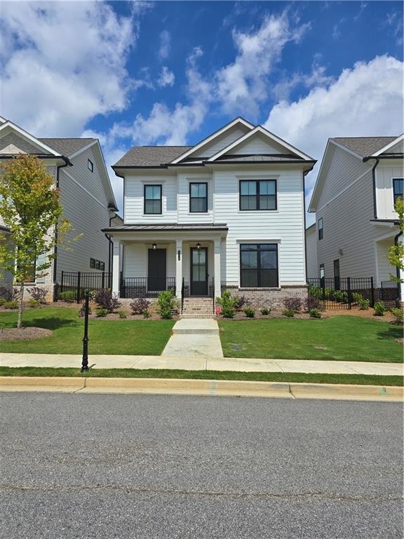 View of front of house with covered porch