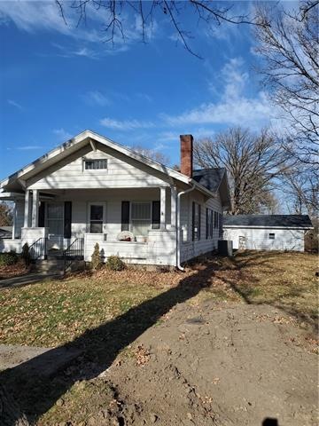 Street View of front and Garage in the background
