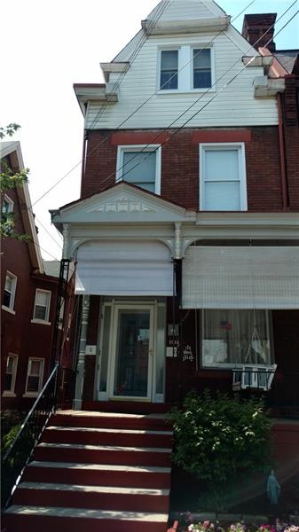Front of house with comfortable porch