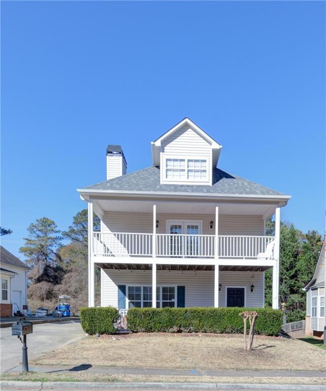View of front of home with a balcony