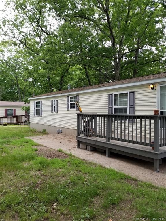 Exterior has cement patio and ramped deck