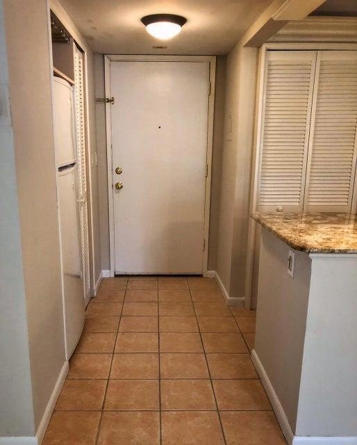 Entry door and stackable washer dryer on