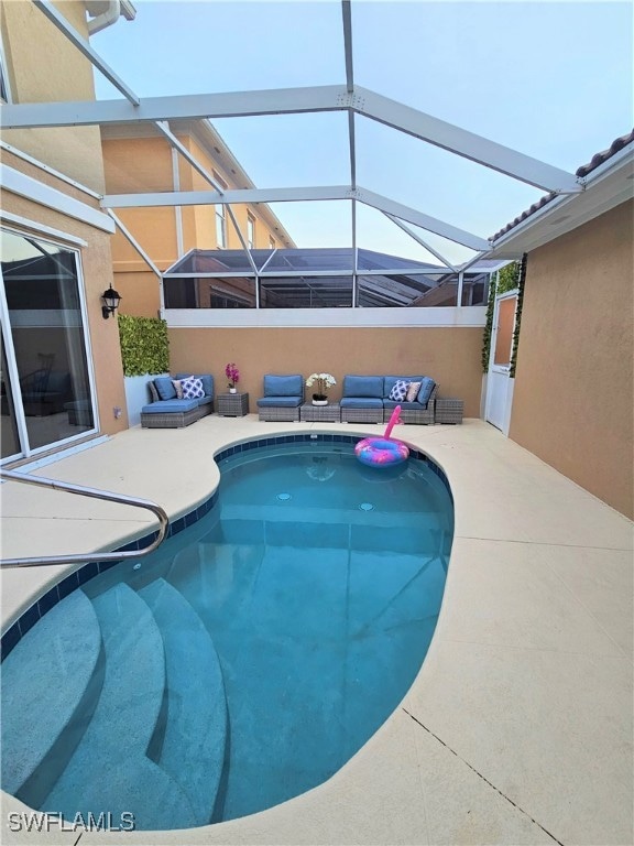 View of swimming pool featuring a patio area, an o