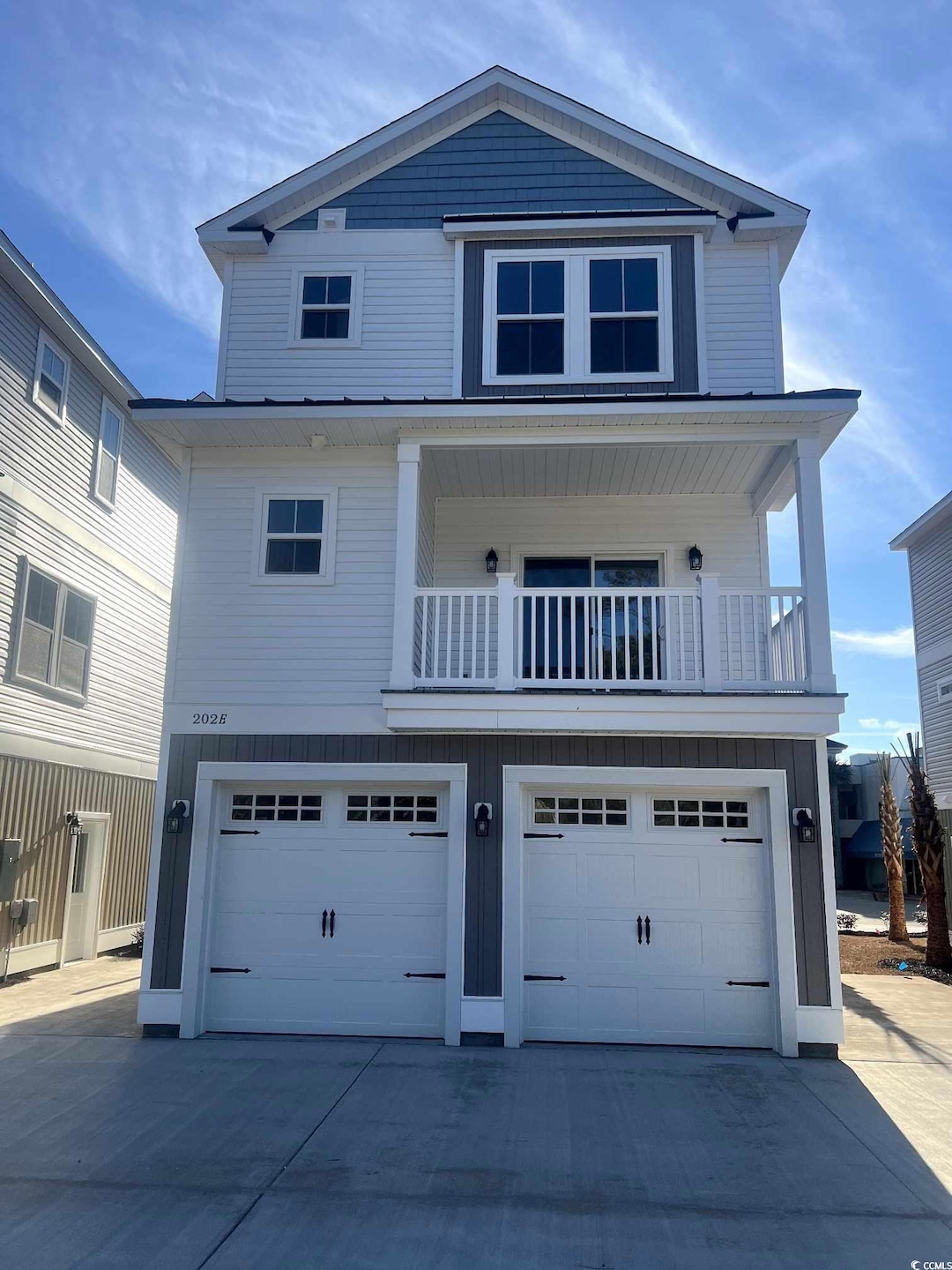 View of front of property featuring a balcony and 