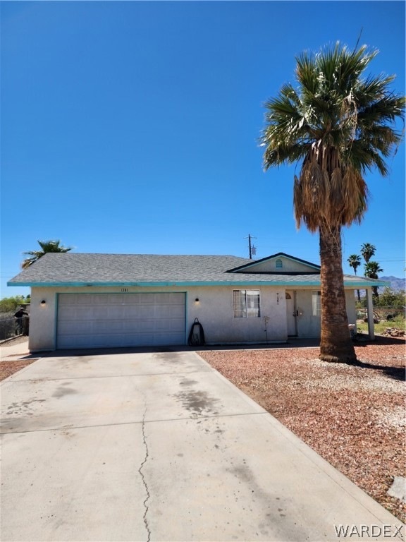 Ranch-style home with a garage