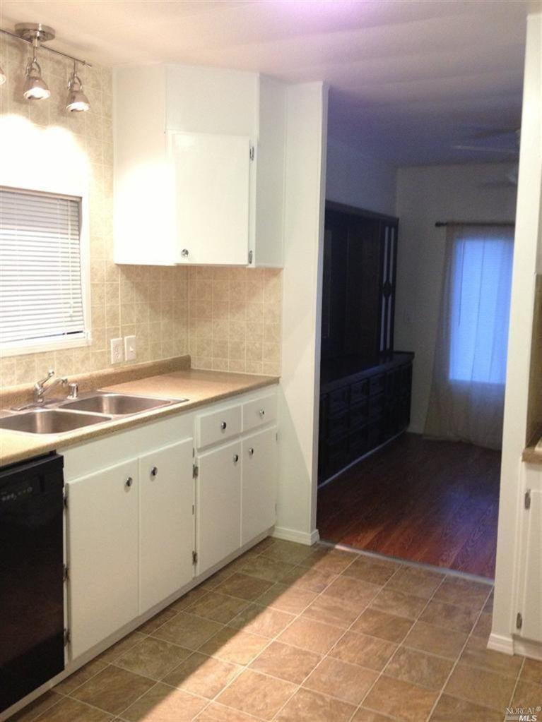 New kitchen countertops, light fixtures, and floor