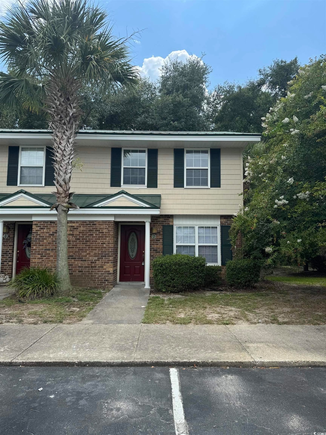 View of front of property featuring brick siding a
