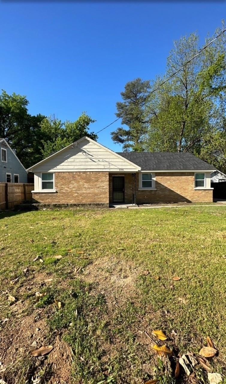 Back of property with brick siding