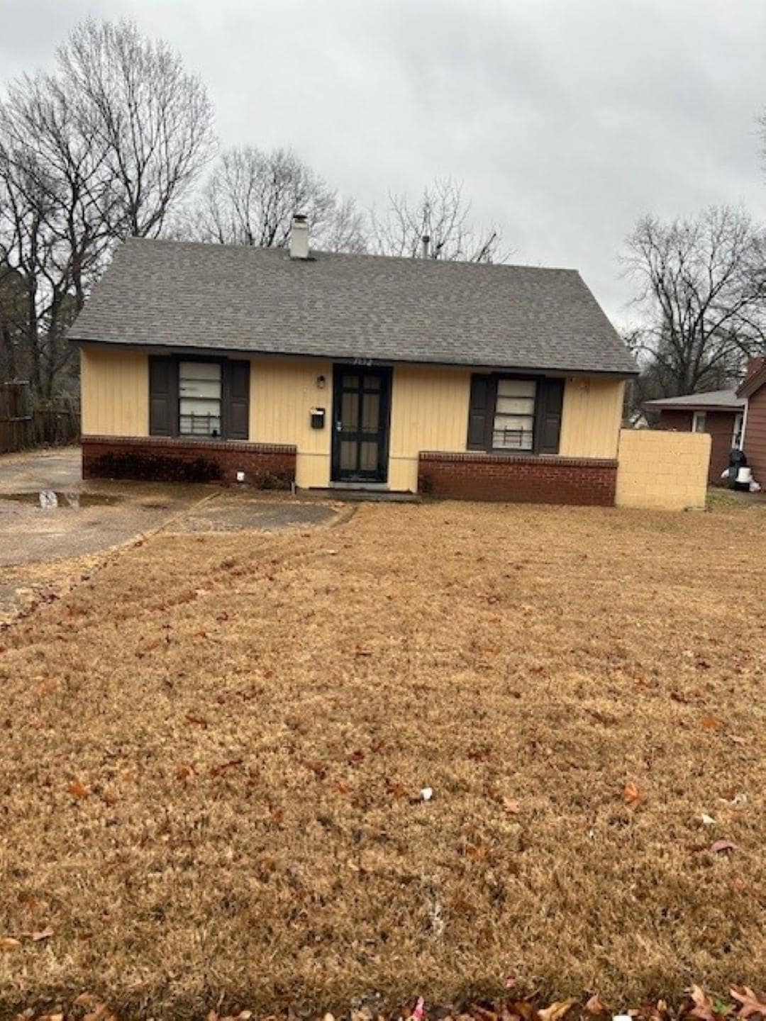 Ranch-style home featuring a front lawn