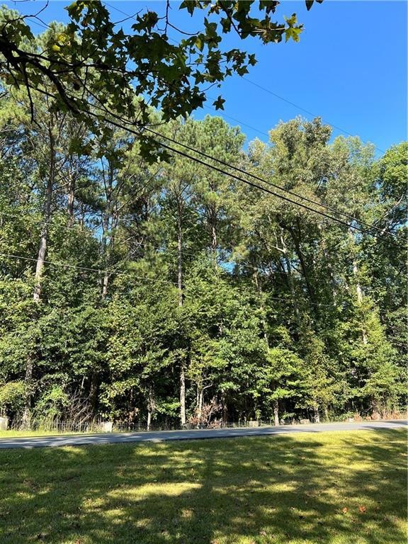 5 Lush Acres of Mature Hardwoods and Pines. A Coun