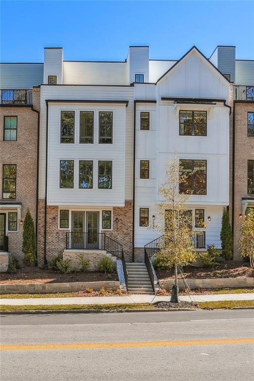 View of front of home featuring central AC unit