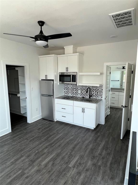 Kitchen featuring appliances with stainless steel