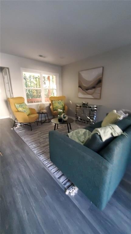 Living room with wood-type flooring
