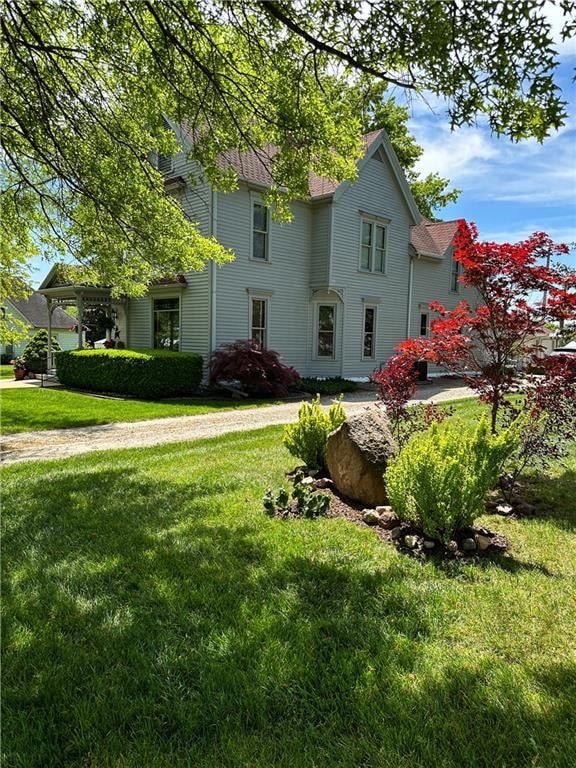 View of front of house featuring a front lawn