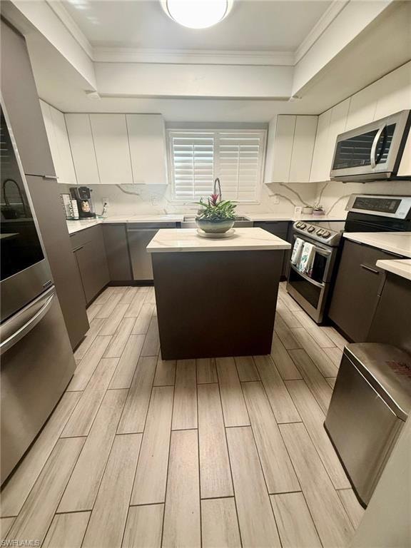 Kitchen featuring wood tiled floor, modern cabinet