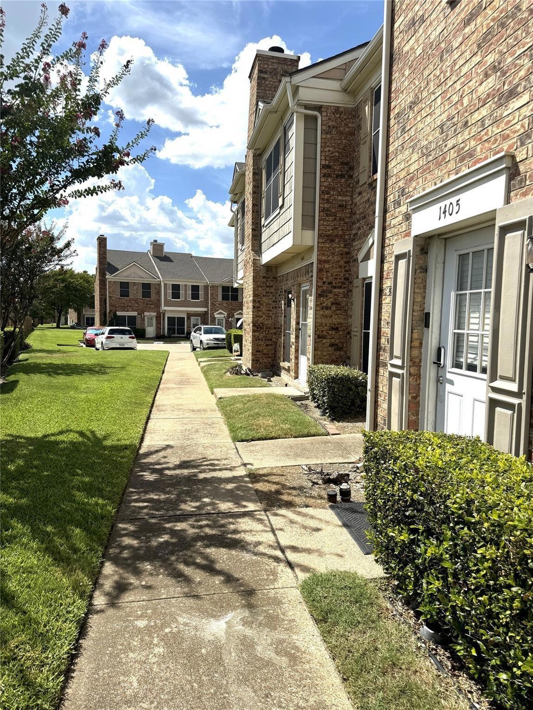View of property's community featuring a yard