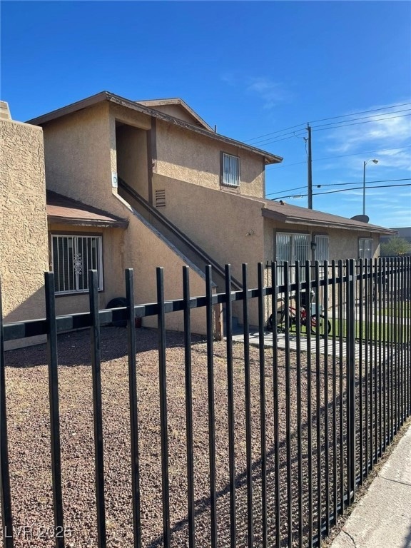 View of property exterior with stucco siding
