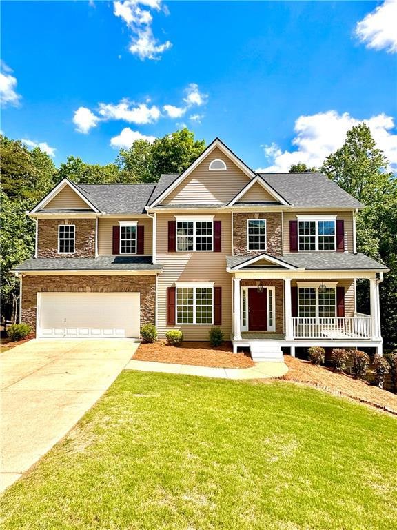 View of front facade featuring an attached garage,
