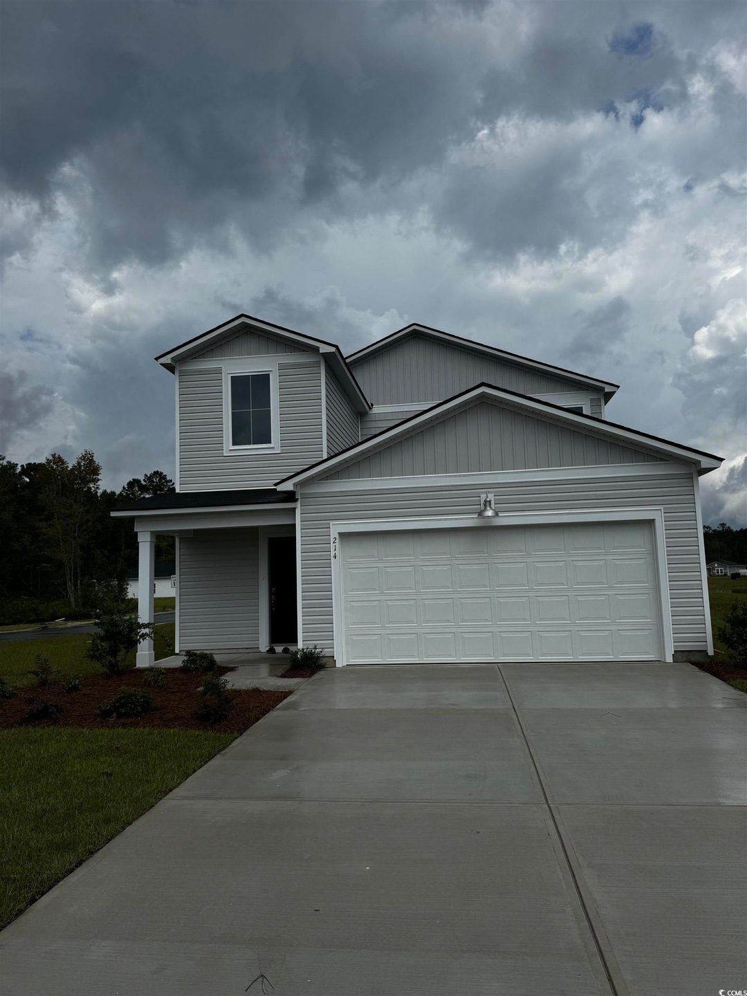 View of property with a garage