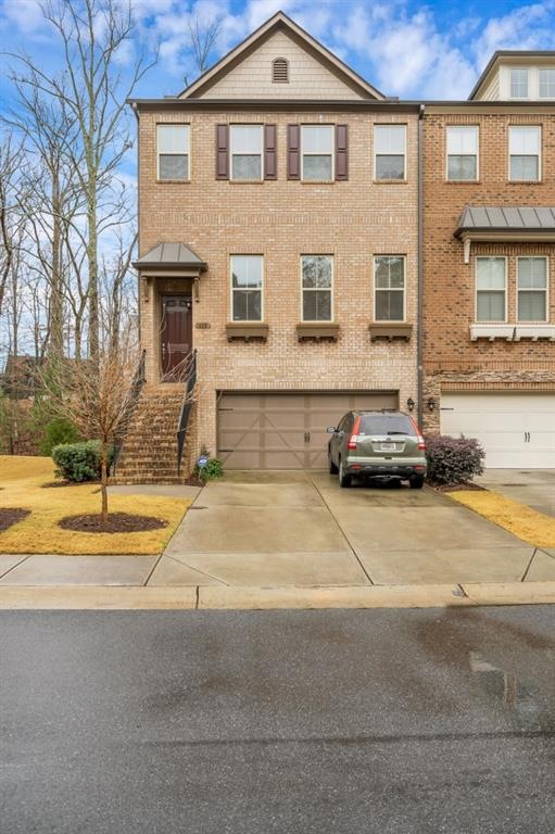 3 story brick townhome with 2 car garage