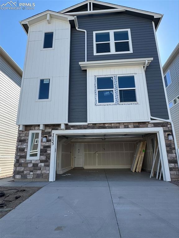 View of front of home featuring a garage