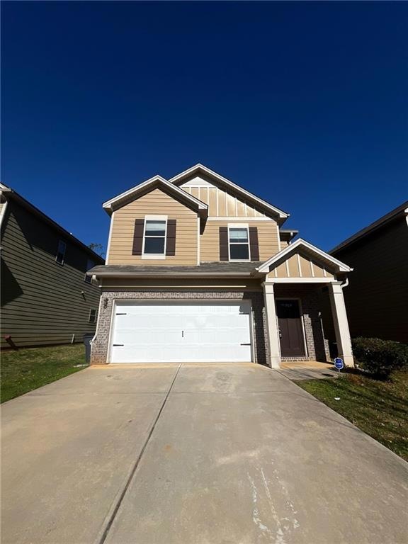 View of front of property featuring a garage