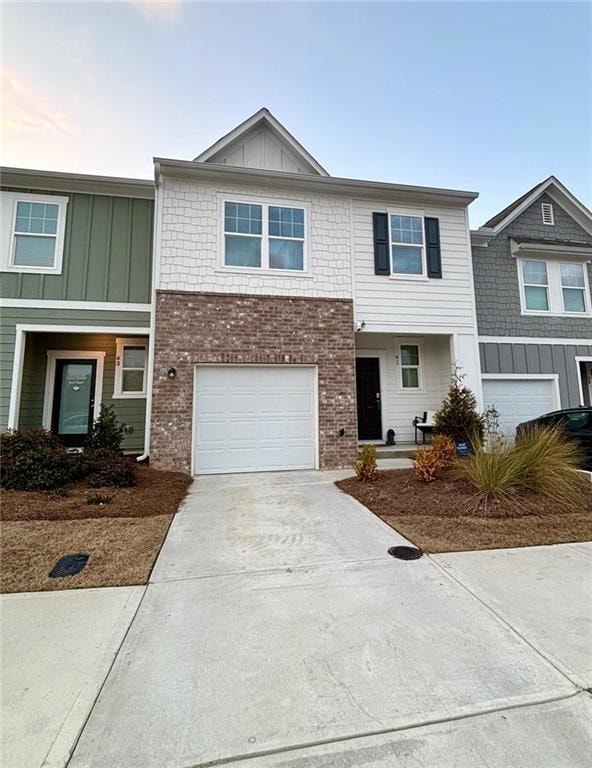 Townhome / multi-family property with a garage