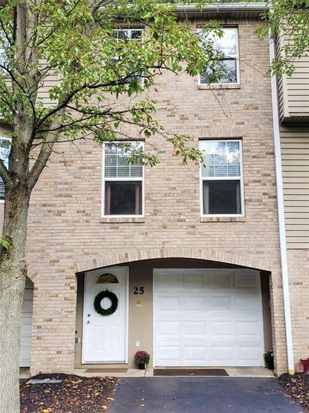 Charming brick front townhouse is tucked away in a