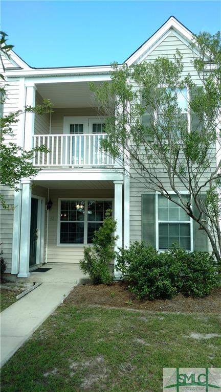 Two story townhome with upper and lower porches