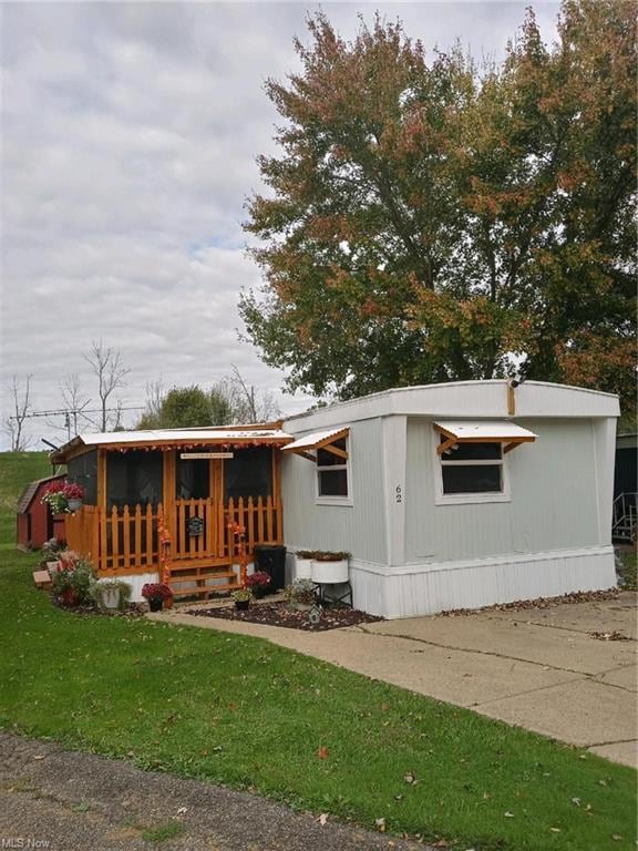 Front view with sunroom.