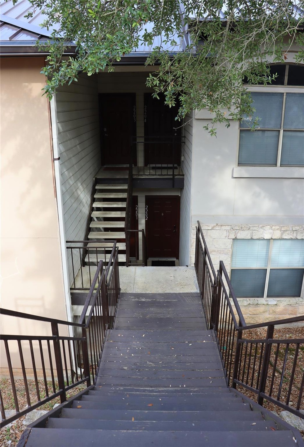 View of exterior entry with stucco siding