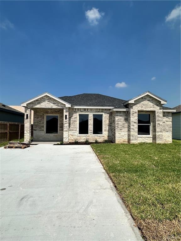 View of front of property featuring a front lawn
