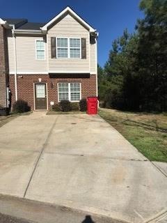 Front view of property showing parking pad for 2 c